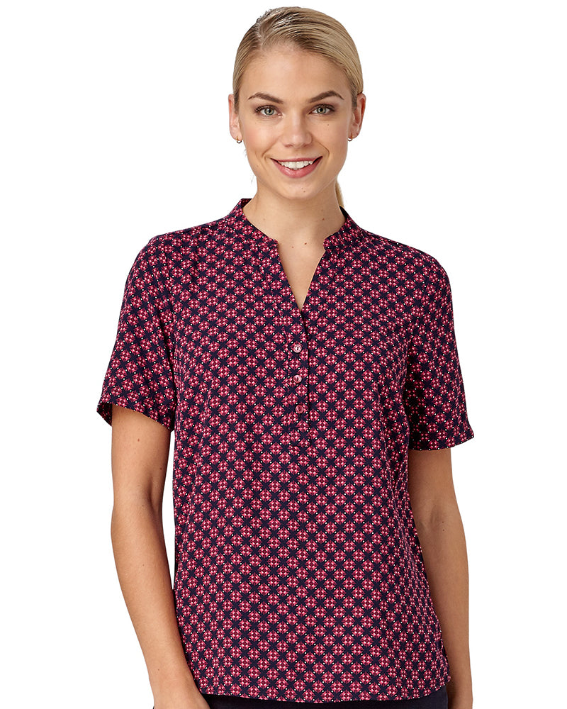 Woman In Crepe Red Pop Over Top With A Tile Print Design