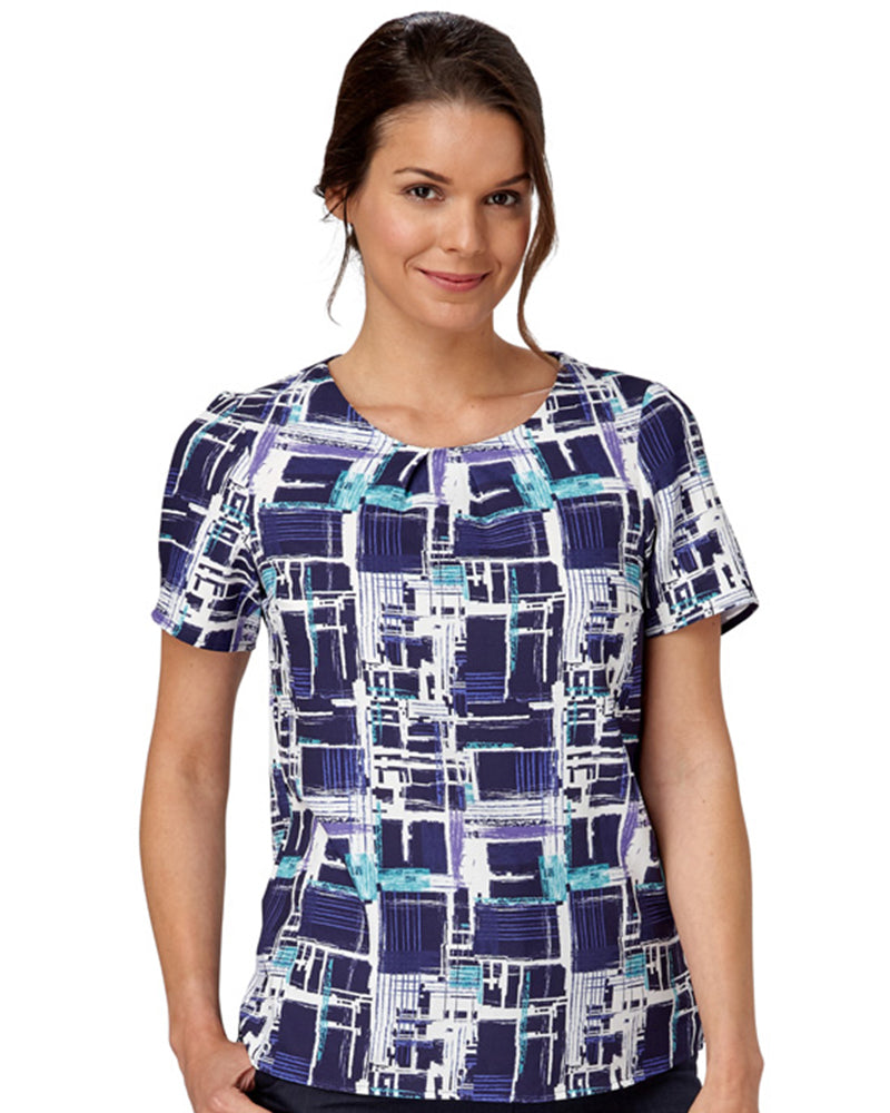 Woman In A Comfort Stretch Blouse With A Paint Print Design