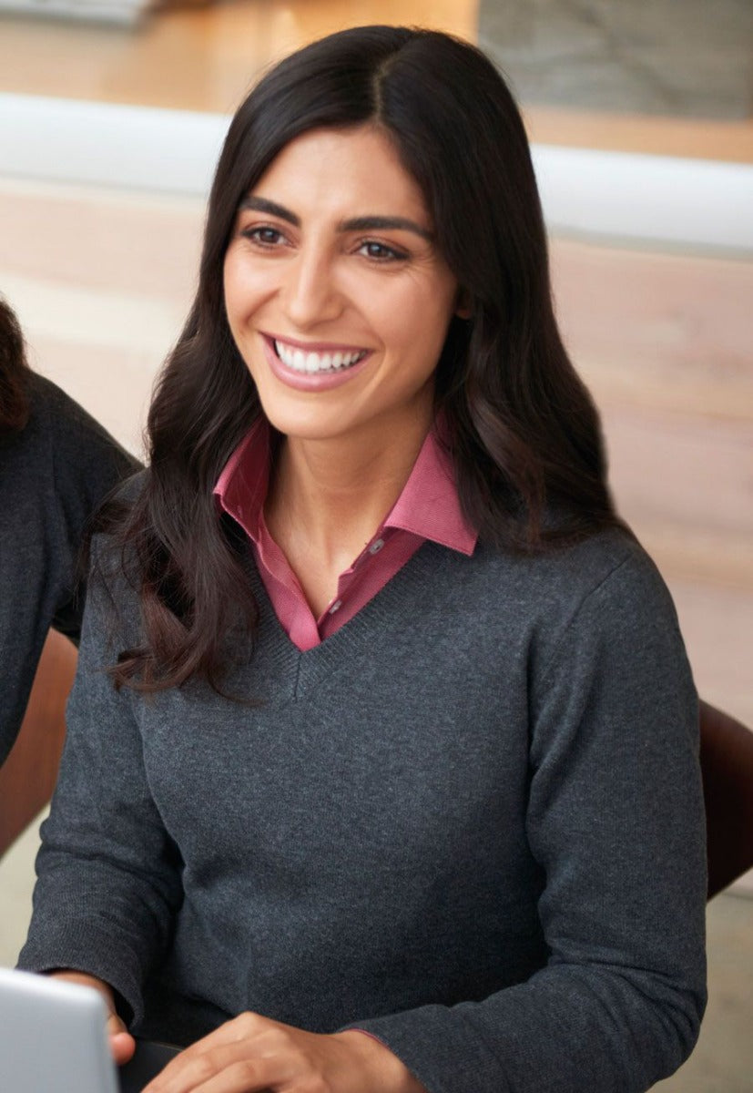 Woman Wearing A Charcoal Grey V Neck Jumper