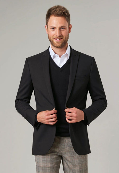 Man Wearing A V-Neck Jumper under a Suit Jacket