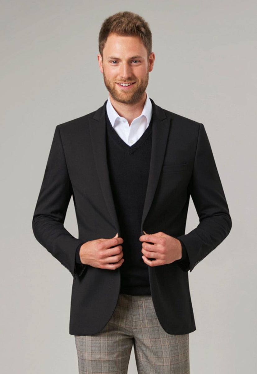 Man Wearing A V-Neck Jumper under a Suit Jacket