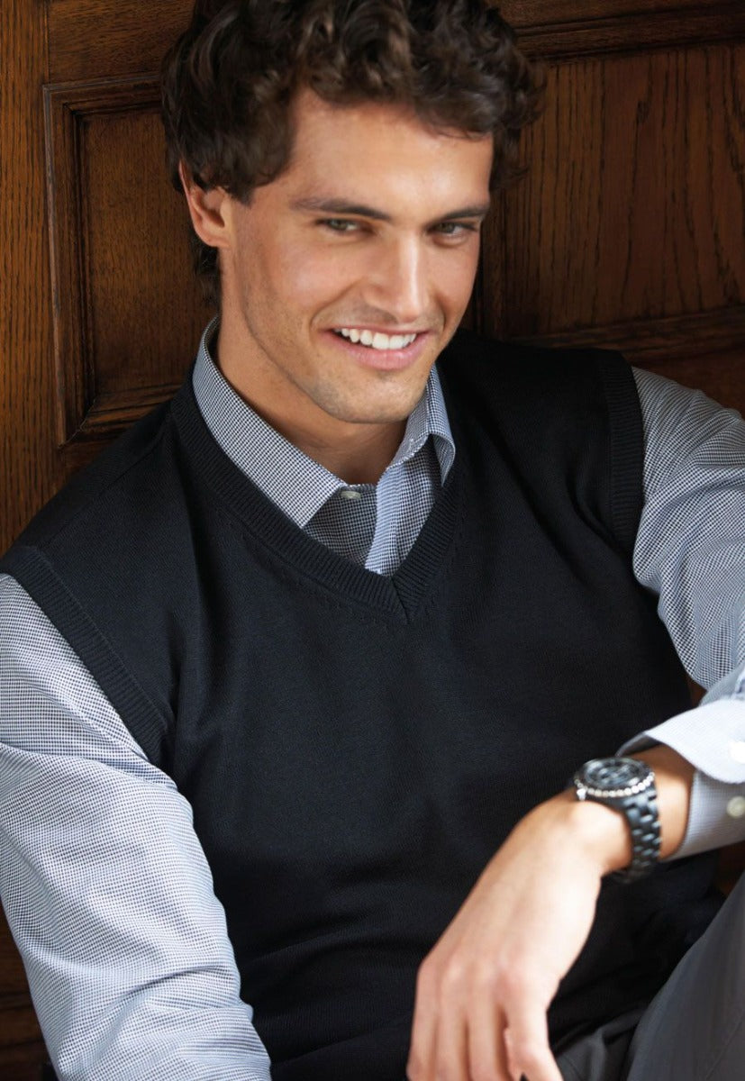 Man Wearing A Navy V-Neck Sleeveless Jumper