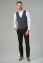 Man Wearing A Tweed Waistcoat and Black Chino Trousers