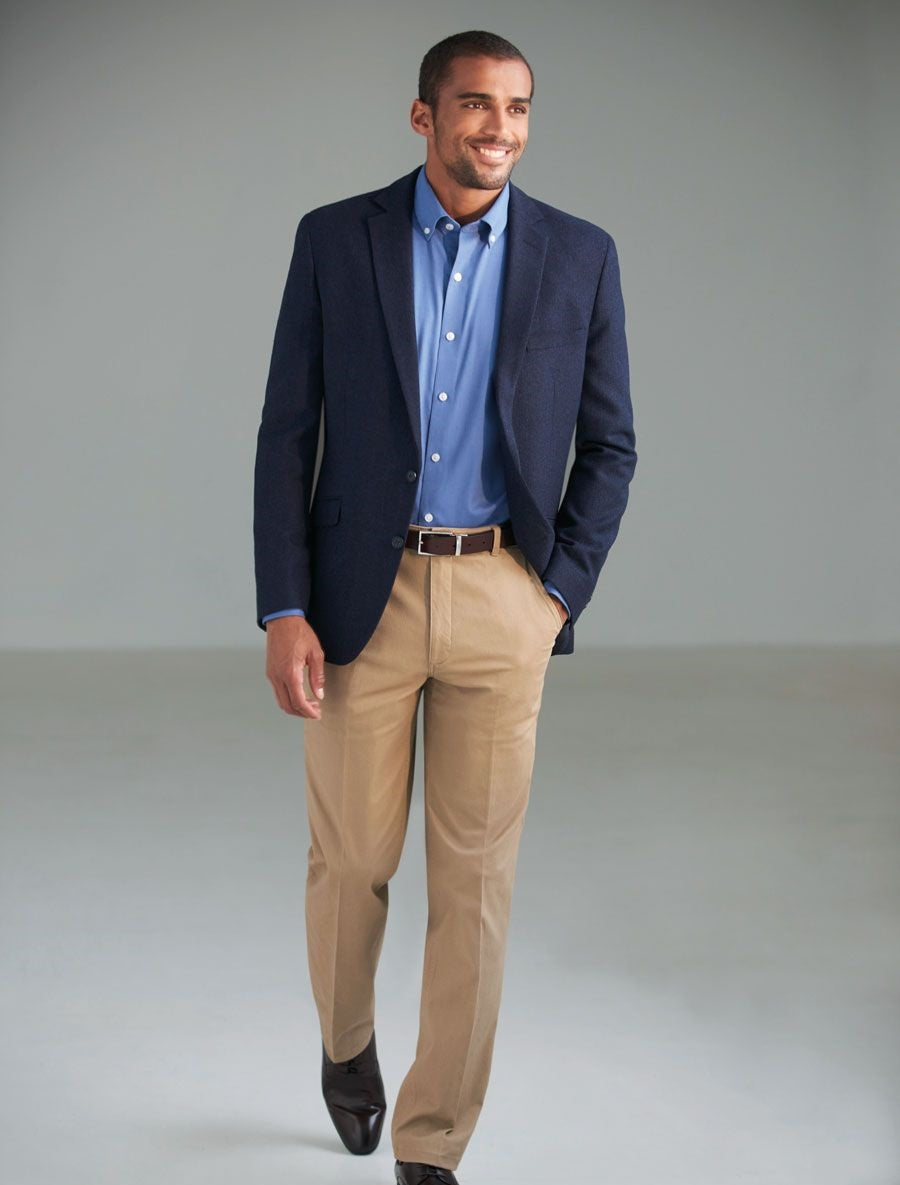 Man Wearing A navy Blazer And Beige Chino Trousers