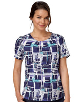 Woman In A Comfort Stretch Blouse With A Paint Print Design