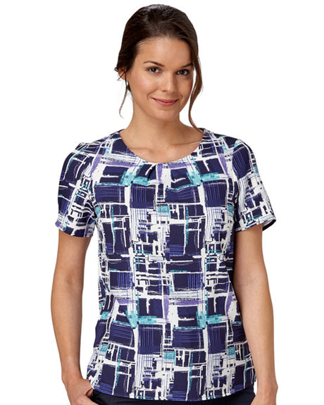 Woman In A Comfort Stretch Blouse With A Paint Print Design