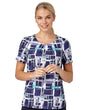 Woman In A Comfort Stretch Blouse With A Paint Print Design